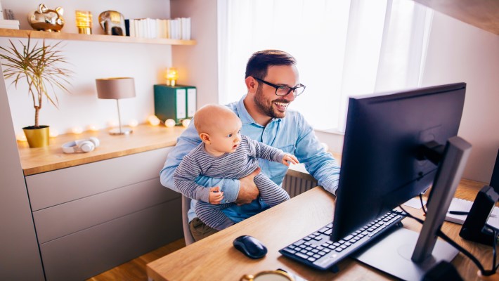 A woman is working on the computer