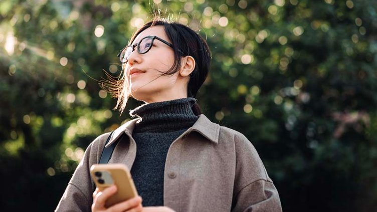 Women standing with a mobile