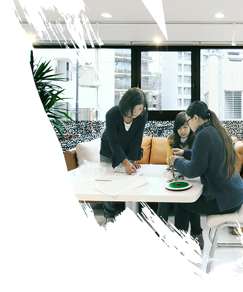 Three women discussing about the project