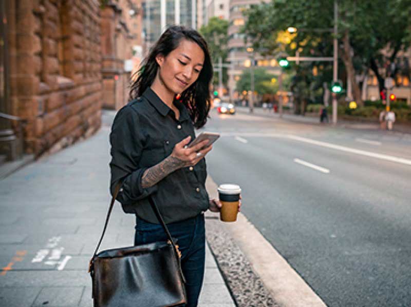 Girl smiling and looking at the mobile