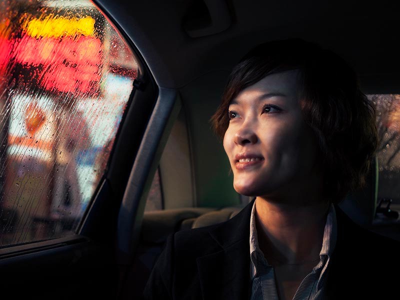 woman inside a car looking outside