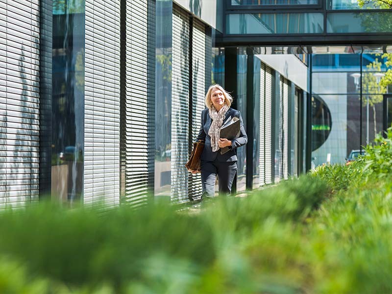 Woman outside a sustainable building