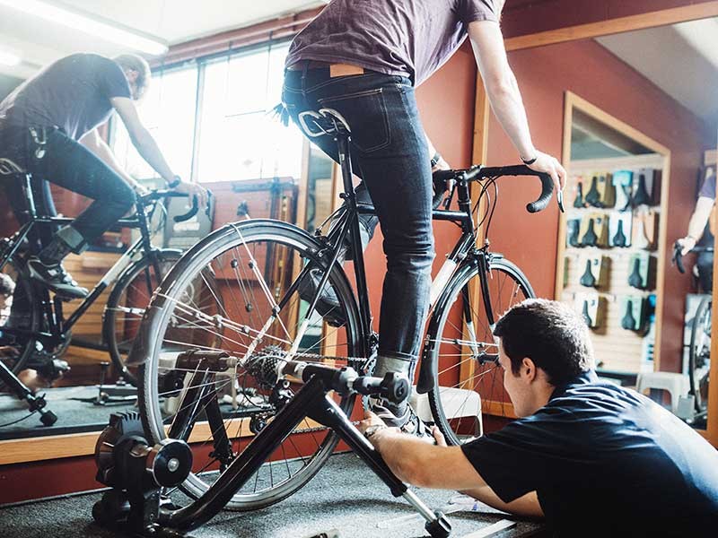 People doing excercise on cycle in a gym